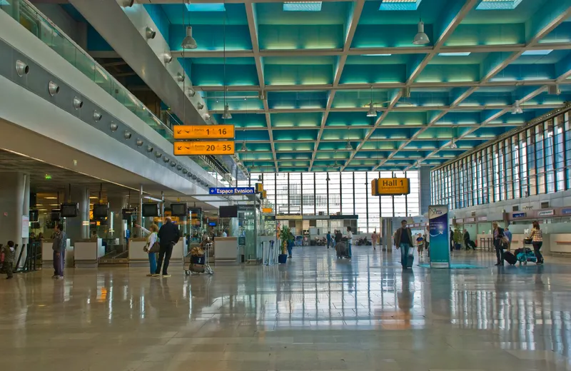 Hall 1 at Marseille Provence Airport with signs to the gates